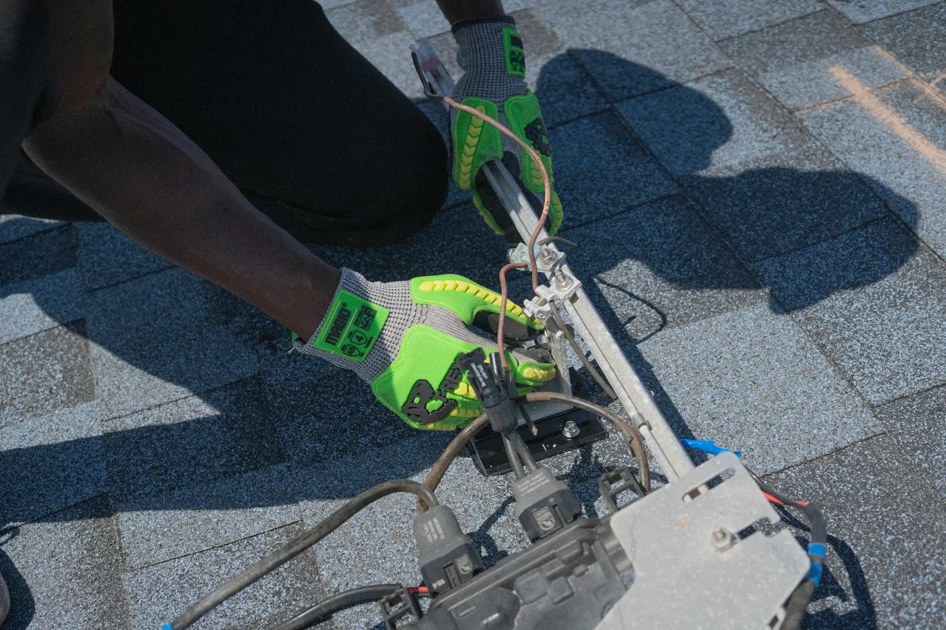 A professional roofer conducting a meticulous inspection on a residential roof in Louisville, checking shingles and flashing.