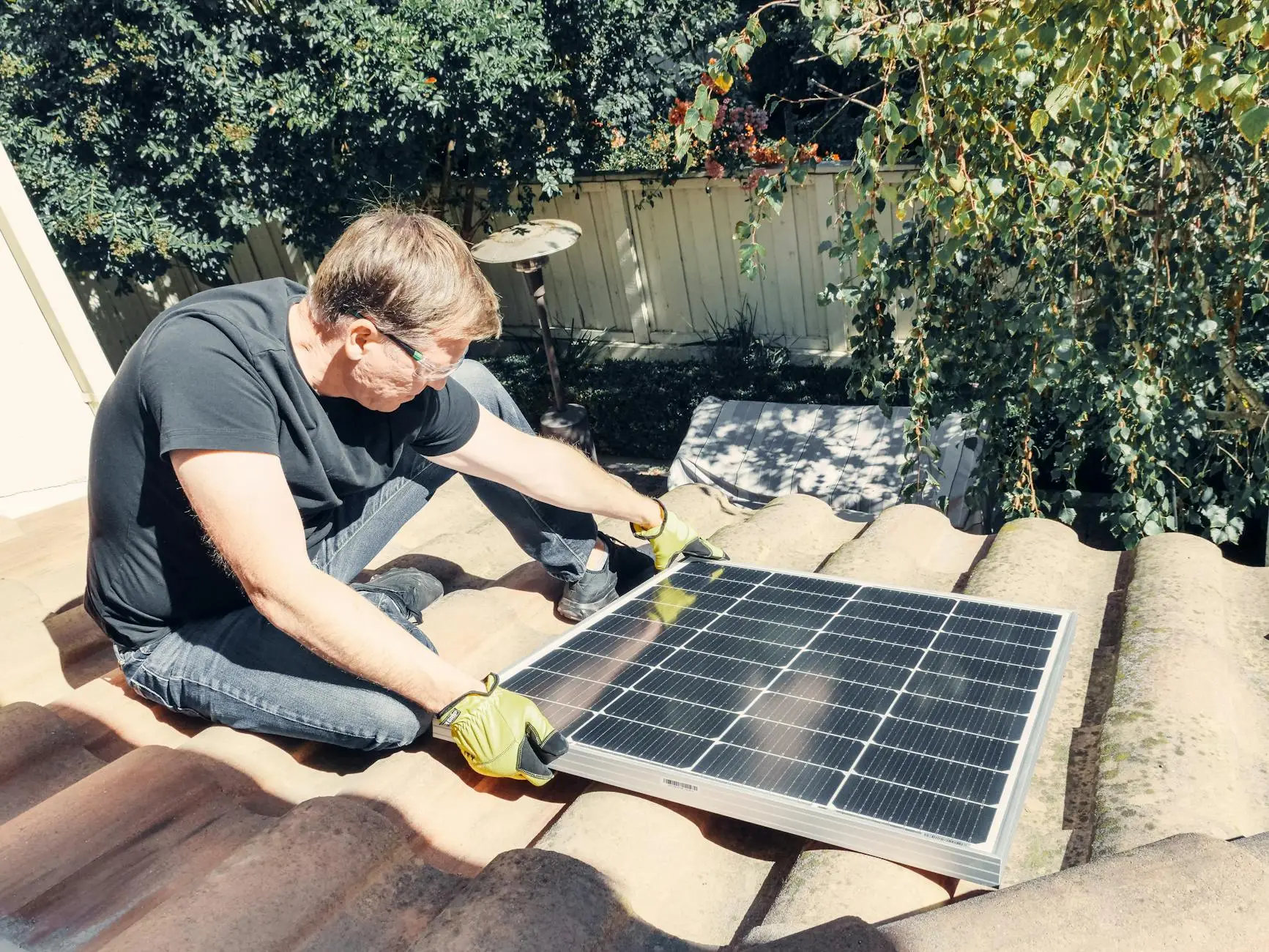 A professional roofing technician inspecting a shingle roof on a residential property in Crestwood.